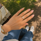 Elegant gold floral adjustable ring featuring ivory petals and sparkling crystal accents, perfect for daily wear, gifting, and festive occasions."