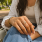 Elegant gold floral adjustable ring featuring ivory petals and sparkling crystal accents, perfect for daily wear, gifting, and festive occasions."