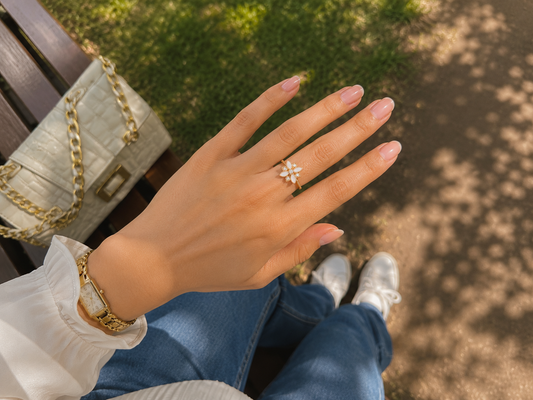 Elegant gold floral adjustable ring featuring ivory petals and sparkling crystal accents, perfect for daily wear, gifting, and festive occasions."