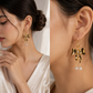 Golden Bow Pearl Drop Earrings